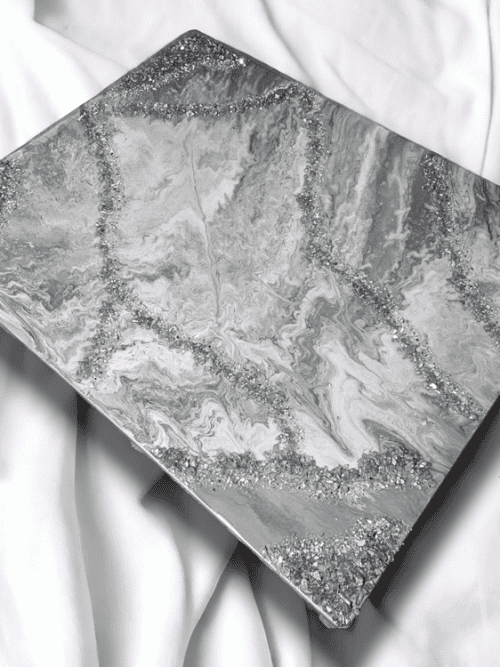This beautiful piece of wall art features a subtle combinations of various shades of silver and gray embellished with cracked fire-glass. With the beautiful compliment of colors and texture, it is sure to be the eye catching piece to complete or build your space around