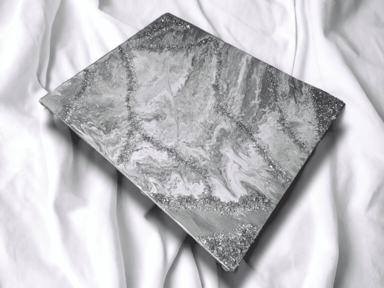This beautiful piece of wall art features a subtle combinations of various shades of silver and gray embellished with cracked fire-glass. With the beautiful compliment of colors and texture, it is sure to be the eye catching piece to complete or build your space around