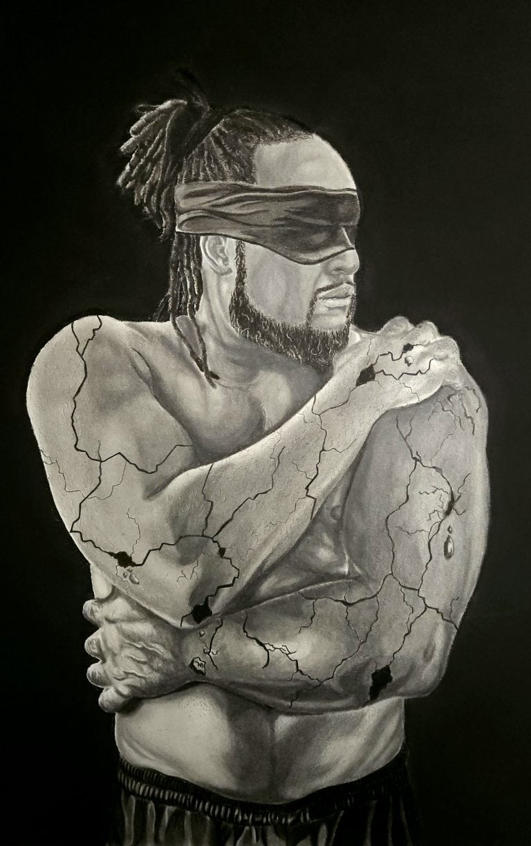 Graphite and charcoal drawing, 'In Pieces pt. 1.' The piece features the torso of a man wearing a blindfold. He crosses his arms to hold himself in a protective gesture, while cracks spiderweb across his skin, rendered with detailed shading to resemble fractured concrete. The monochrome artwork evokes a powerful sense of vulnerability and hidden turmoil.