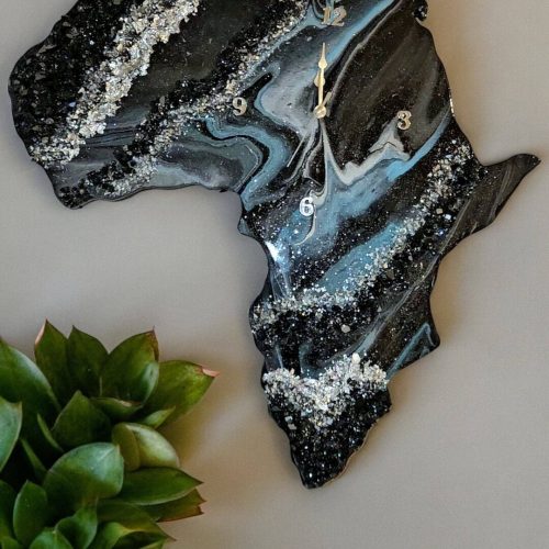 Image of an Africa Shaped piece of functional art by artist James Sanders. It features a combination of the turquoise, silver, black, and white, embellished with resin, fire glass, silver leaf, and gem stones.