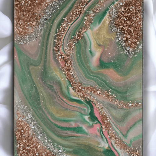 Image of the art piece "Divine" by artist James Sanders. It features a combination of the green, pink, gold, white, and rose gold, embellished with resin, fire glass, and gem stones.